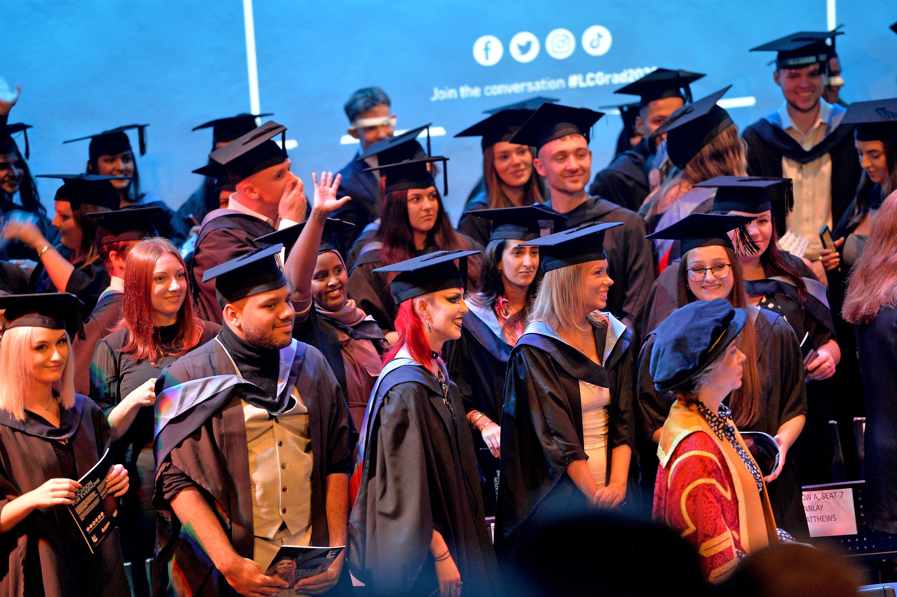 Group of happy graduates at Leicester College graduation