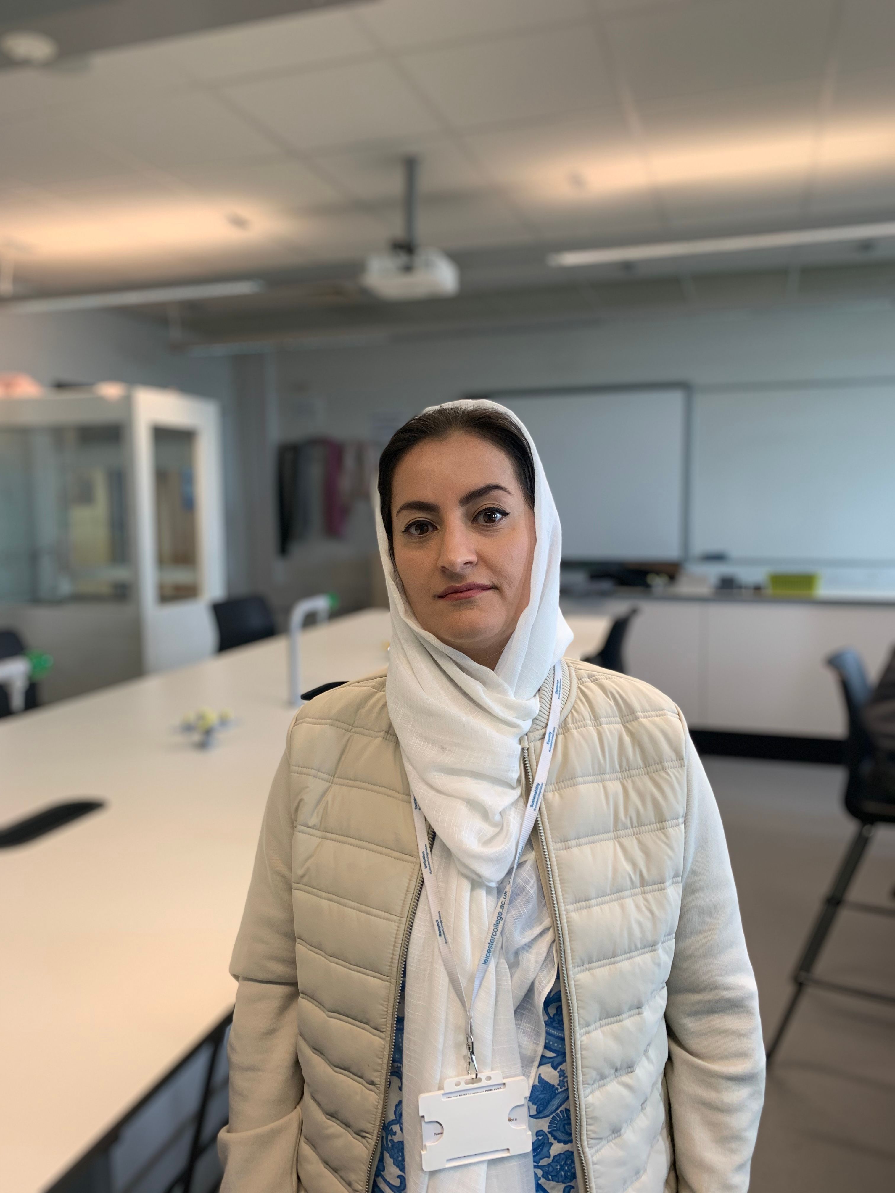 maria, lady with headscarf standing in a science classroom