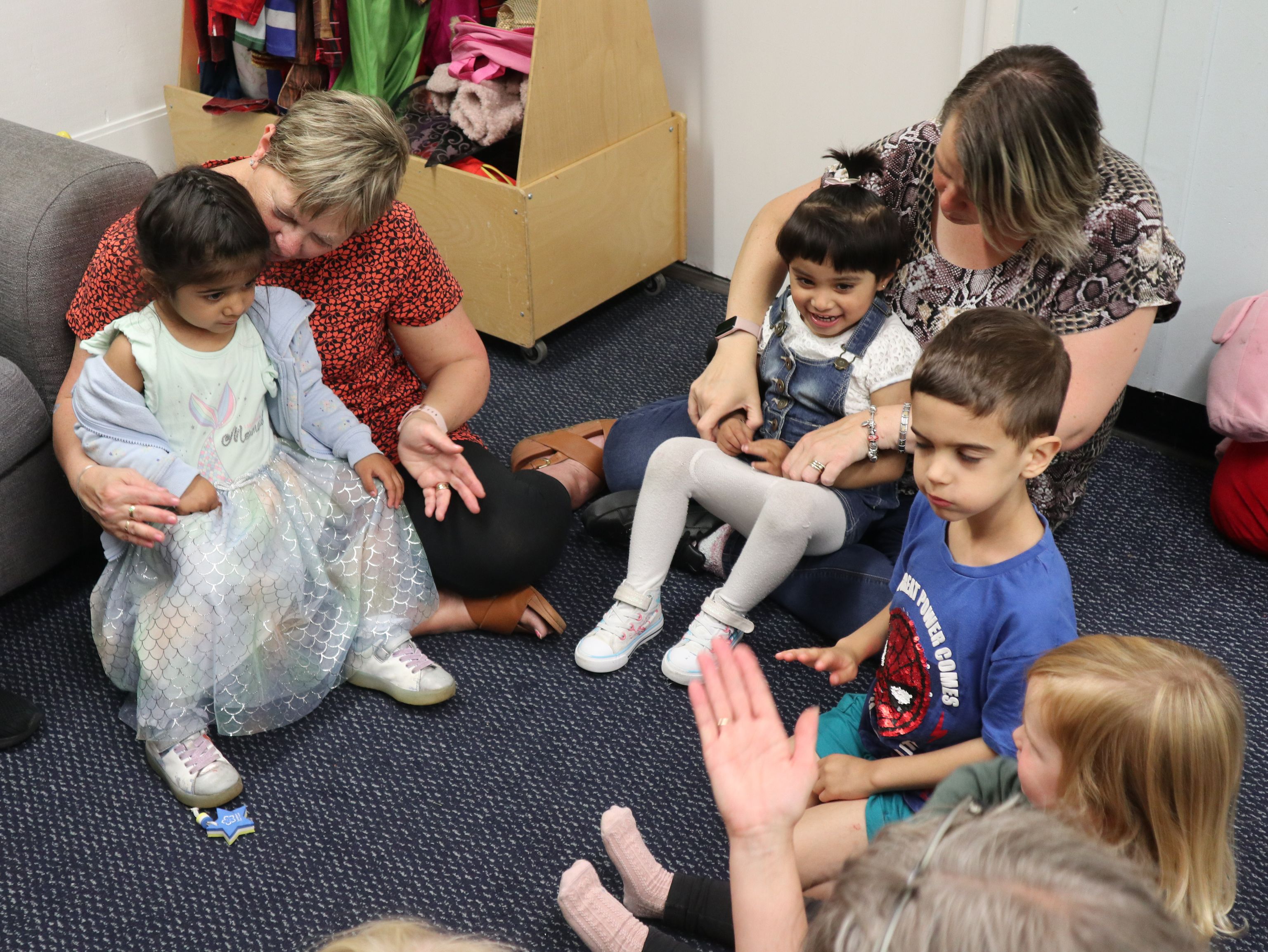 staff playing with children