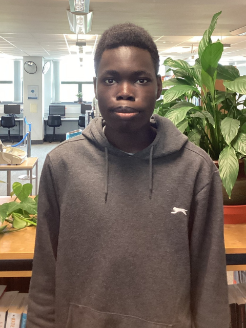 black student wearing a grey hoodie