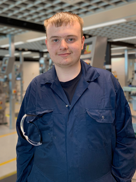 Engineering student wearing PPE navy overalls