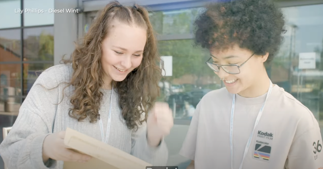 Students opening results looking happy.